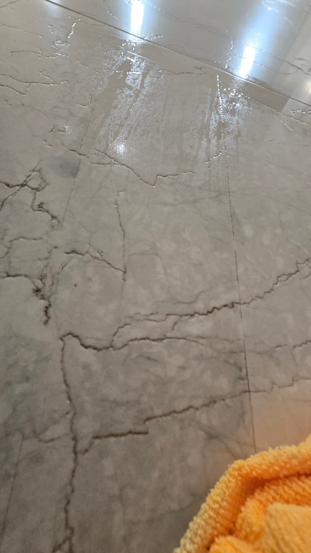 Marble shower wall installation in Scottsdale AZ with epoxy grout haze removed and the stone polished back to a uniform finish