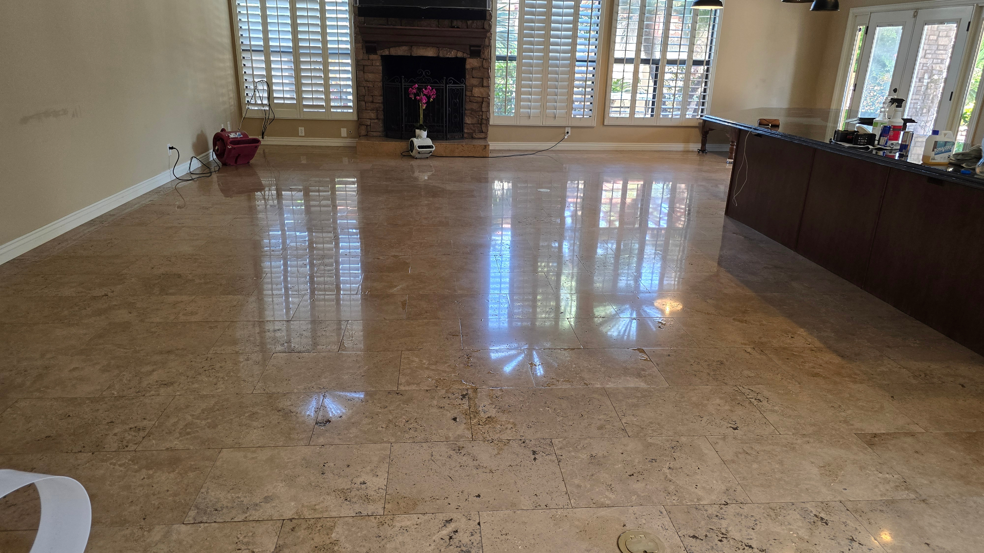 Travertine floor after deep cleaning and chemical polish in Ahwatukee Foothills home showing restored shine